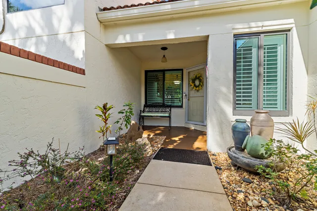 a front view of a house with outdoor seating