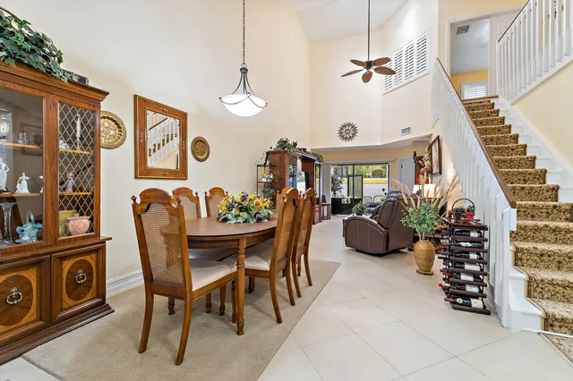 a view of a dining room with furniture and entryway