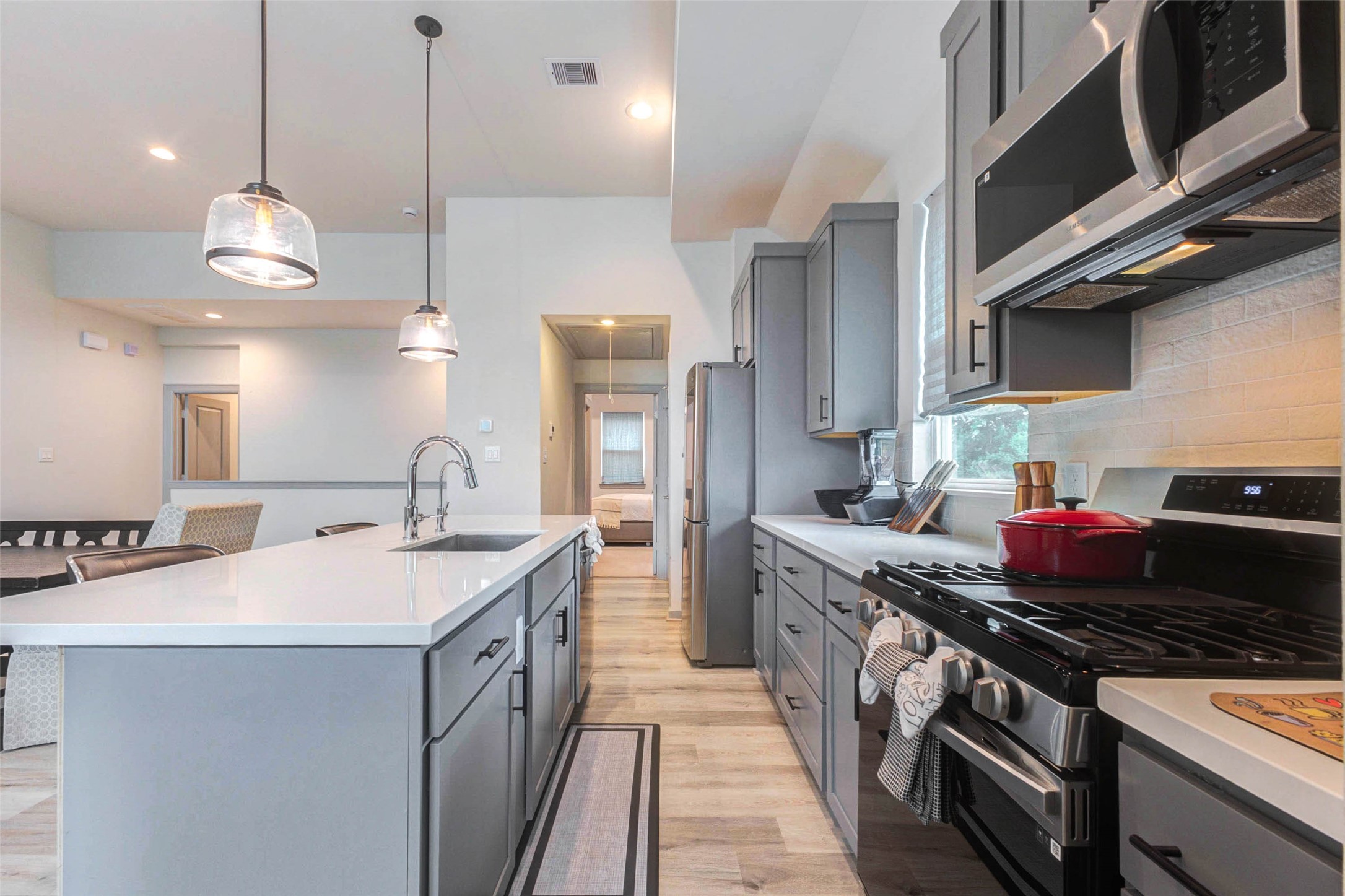 4502 Buck Street Houston, TX 77020 - Photo 17 of 27 Quartz counter tops, single basin sink, filtered water system, shaker cabinets, and gas range, what more could you ask for?
