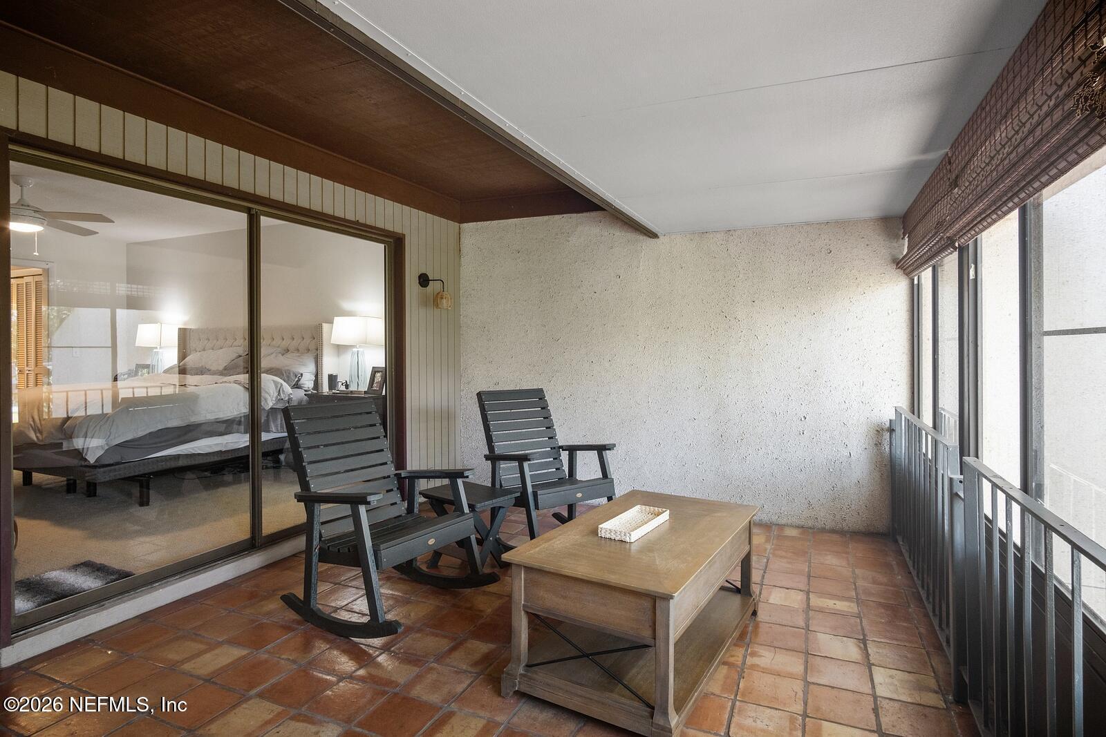 8012 Hollyridge Road, Unit 17U Jacksonville, FL 32256 - Photo 20 of 22 a view of a hallway with seating area