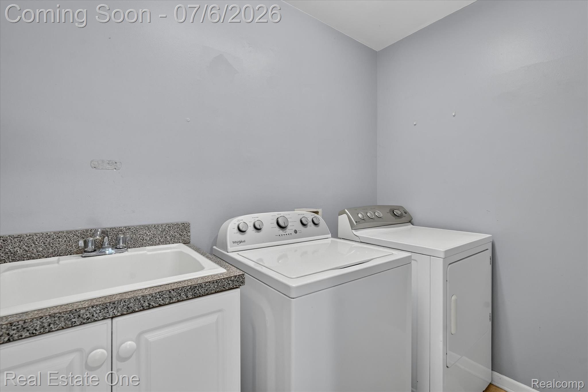 9610 Forest Ridge Drive Clarkston, MI 48348 - Photo 26 of 77 The laundry room is just off the kitchen has plenty of additional room for laundry storage cabinets.