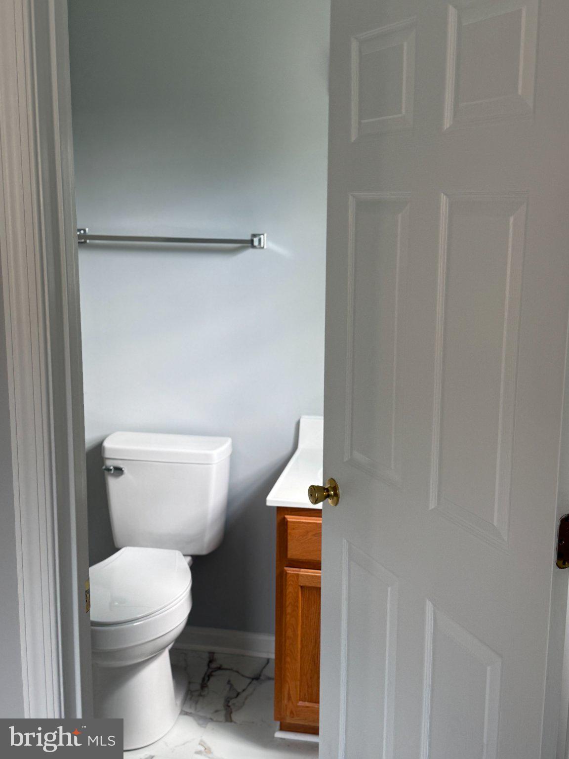 30952 Sandy Ridge Drive Lewes, DE 19958 - Photo 11 of 17 a white toilet sitting next to a shower