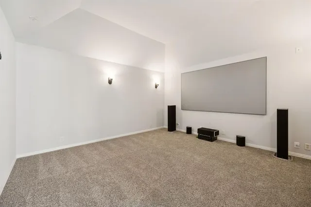 a view of an empty room with windows