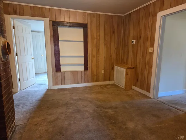 a view of an empty room and a window