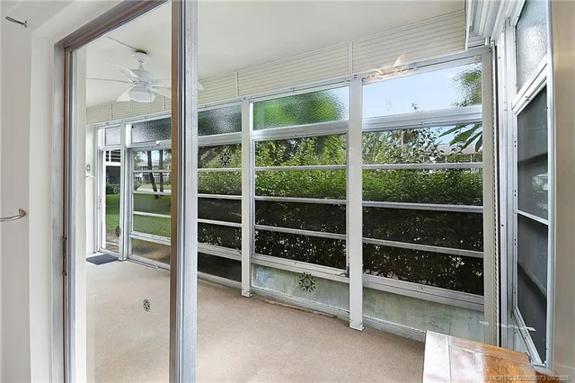 a view of a room with a large window