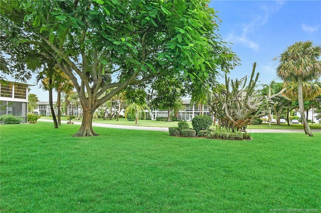 2929 Southeast Ocean Boulevard, Unit 1294 Stuart, FL 34996 - Photo 21 of 30 a huge green field with lots of trees