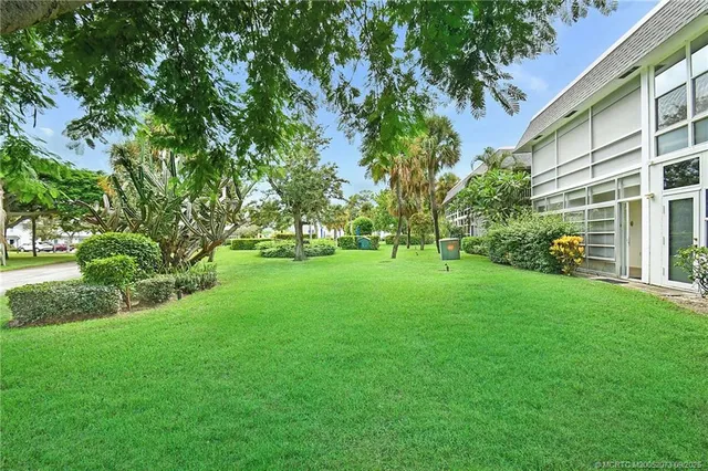 a view of a park with large trees
