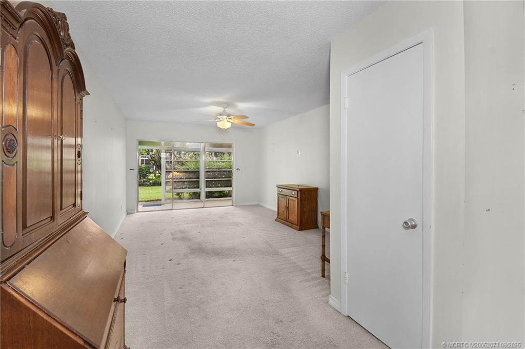 2929 Southeast Ocean Boulevard, Unit 1294 Stuart, FL 34996 - Photo 7 of 30 a view of a livingroom with furniture and staircase