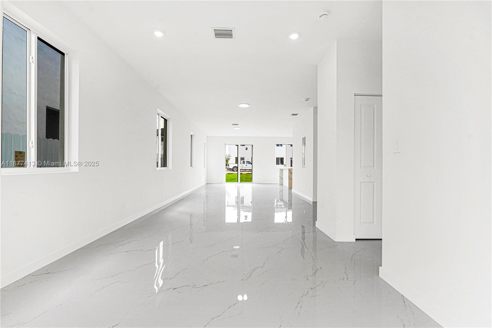 22425 Southwest 125th Avenue, Unit 19A Miami, FL 33170 - Photo 2 of 61 a view of a hallway with white doors