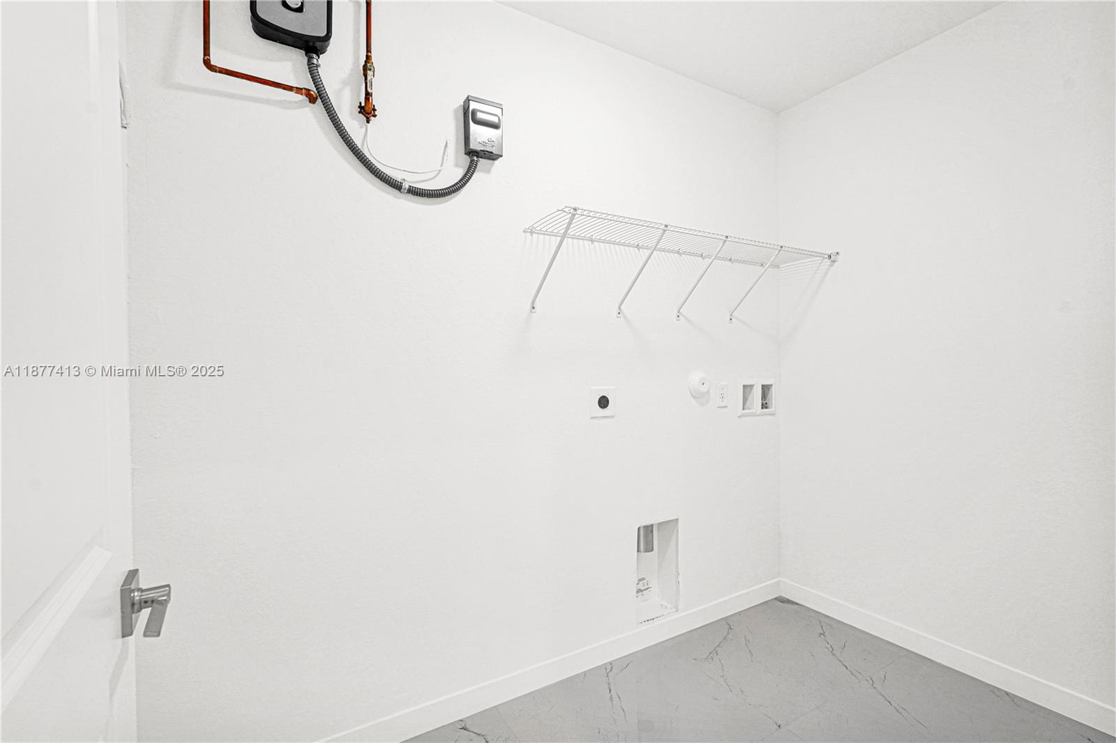 22425 Southwest 125th Avenue, Unit 19A Miami, FL 33170 - Photo 31 of 61 a view of a room with racks on the wall