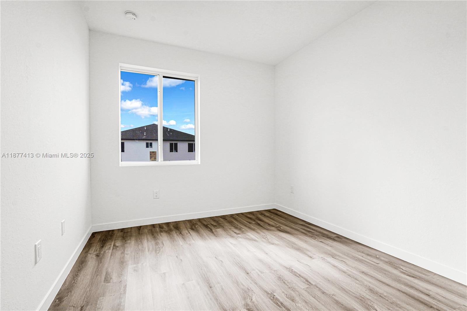 22425 Southwest 125th Avenue, Unit 19A Miami, FL 33170 - Photo 42 of 61 a view of a room with wooden floor and window
