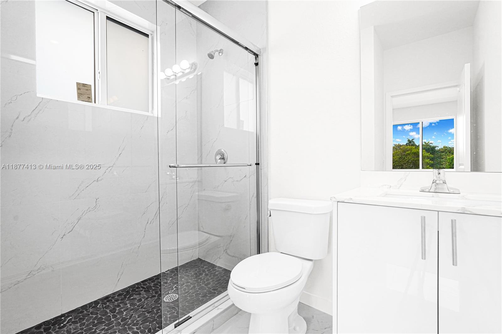 22425 Southwest 125th Avenue, Unit 19A Miami, FL 33170 - Photo 57 of 61 a bathroom with a sink a toilet and shower