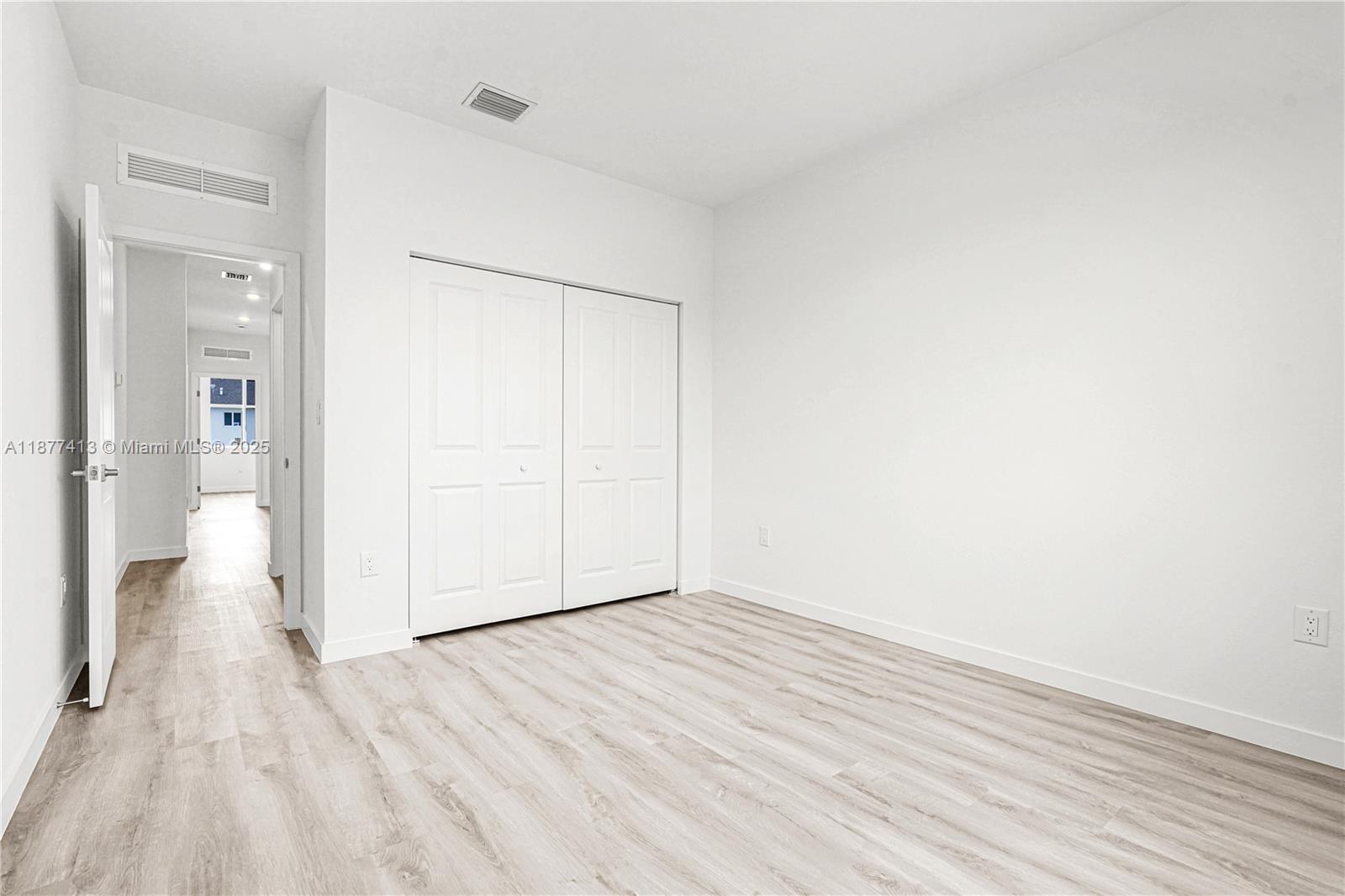 22425 Southwest 125th Avenue, Unit 19A Miami, FL 33170 - Photo 59 of 61 a view of a room with wooden floor