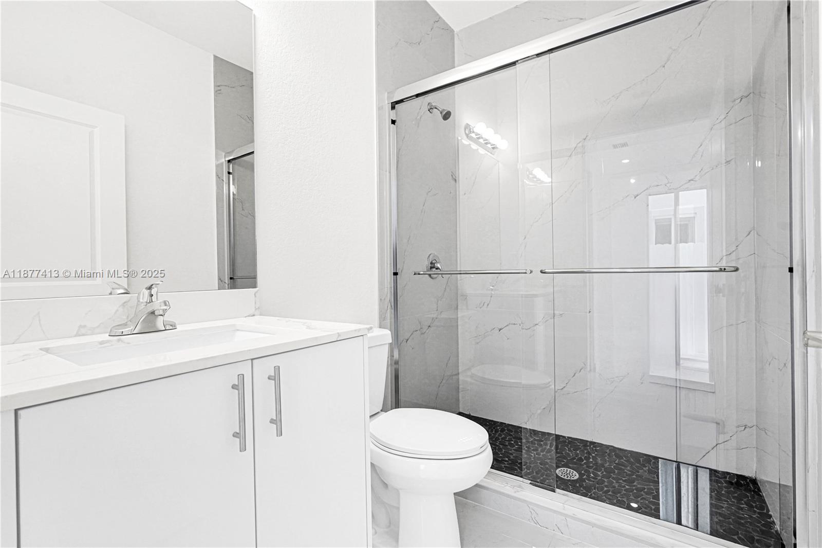 22425 Southwest 125th Avenue, Unit 19A Miami, FL 33170 - Photo 6 of 61 a bathroom with a sink a toilet and shower