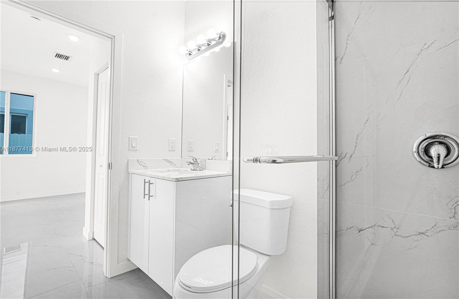 22425 Southwest 125th Avenue, Unit 19A Miami, FL 33170 - Photo 7 of 61 a bathroom with a sink a toilet and shower