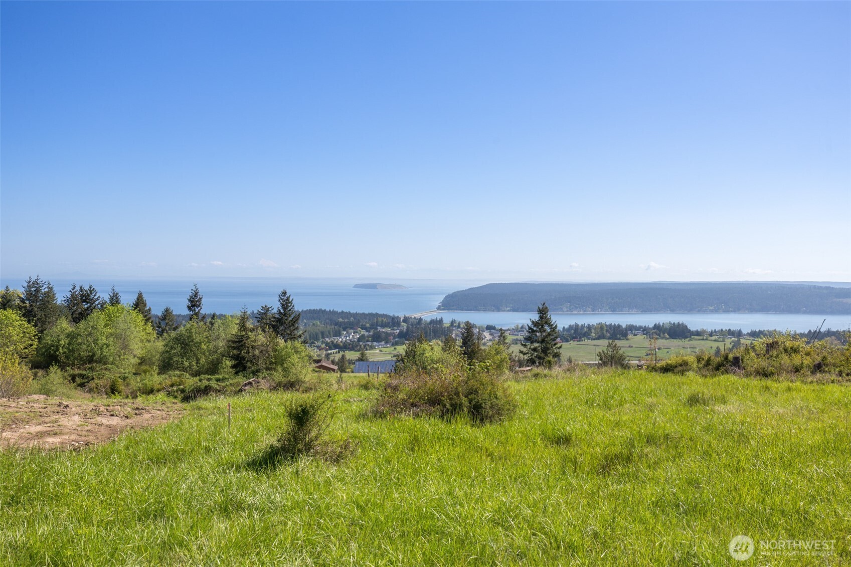 623 Doe Run Road Sequim, WA 98382 - Photo 1 of 13 a view of a city with tall buildings in background