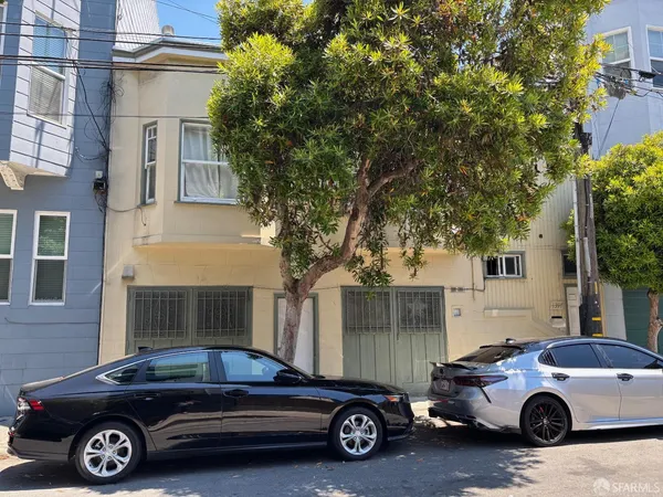 a car parked in front of a house