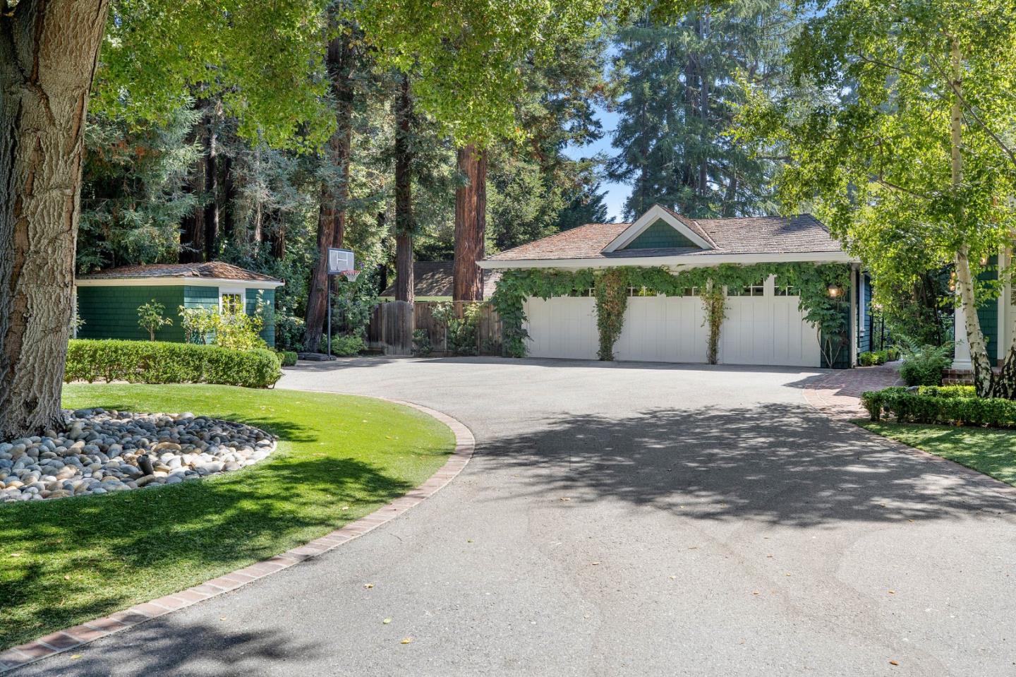 74 Lilac Drive Atherton, CA 94027 - Photo 79 of 81 a front view of a house with a yard and garage