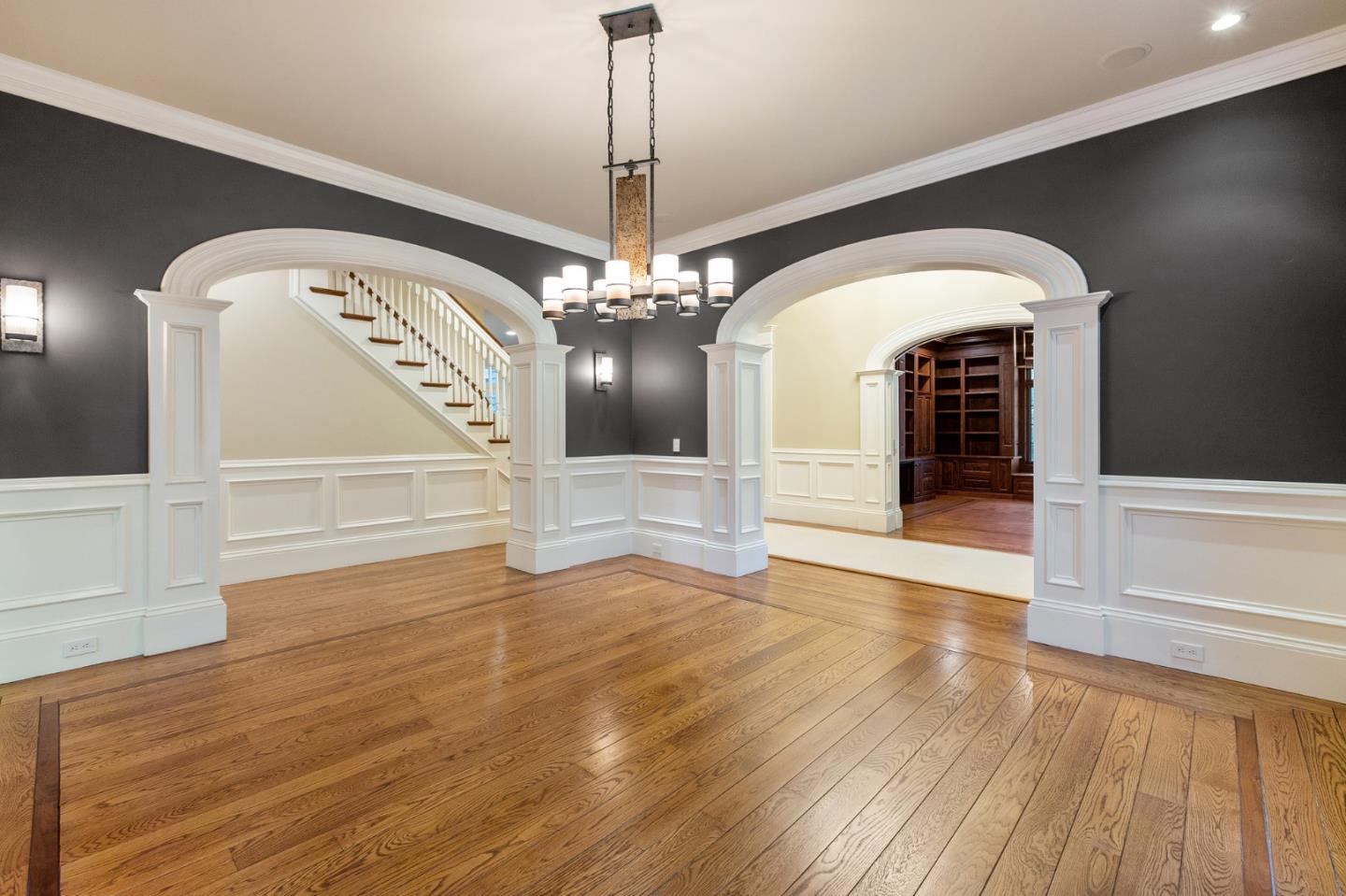 74 Lilac Drive Atherton, CA 94027 - Photo 10 of 81 a view of a hallway with wooden floor staircase and a kitchen view