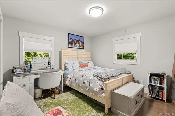 a bedroom with a bed and a table