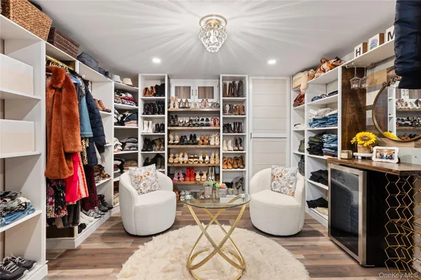 a living room with furniture and a book shelf