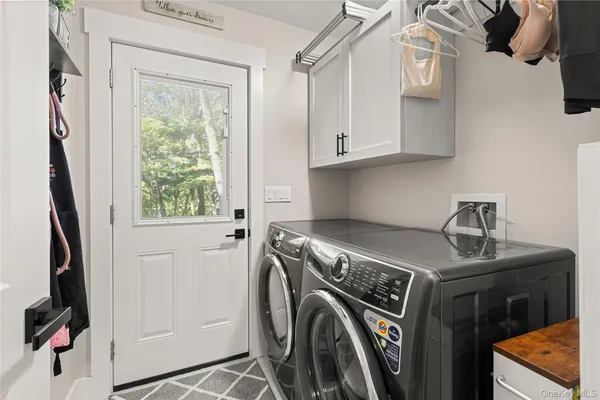 a utility room with dryer and washer