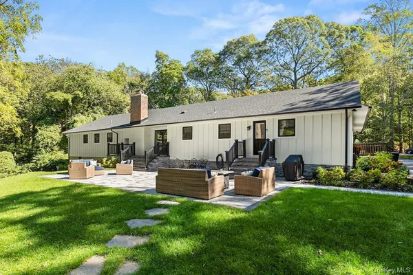 a outdoor view with a sitting space garden and patio