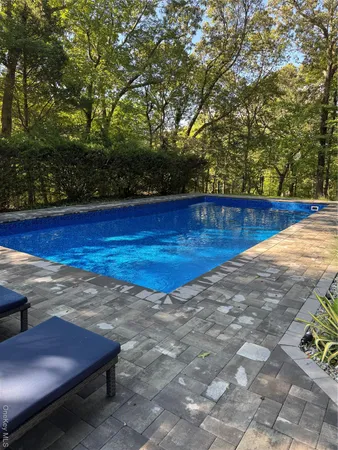 a view of a yard with wooden floor