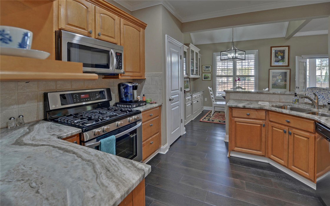 39 Azalea Drive Hartwell, GA 30643 - Photo 15 of 45 This spacious kitchen features ample counter space, rich cabinetry, and durable flooring.