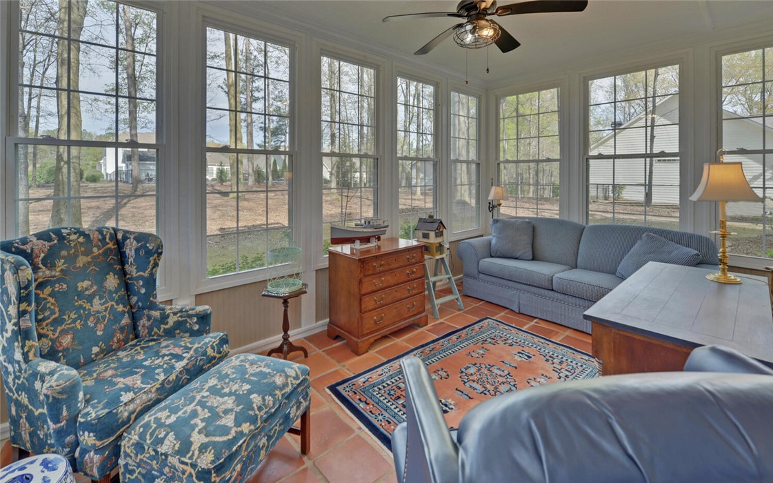 39 Azalea Drive Hartwell, GA 30643 - Photo 17 of 45 This bright sunroom offers abundant natural light, providing a serene indoor-outdoor connection.