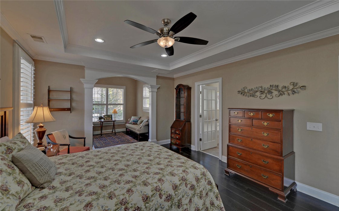 39 Azalea Drive Hartwell, GA 30643 - Photo 21 of 45 This spacious bedroom offers elegant details, including a tray ceiling and dark hardwood flooring.