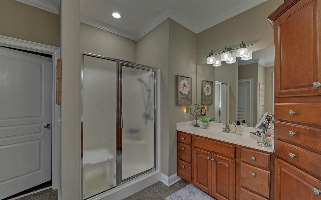 39 Azalea Drive Hartwell, GA 30643 - Photo 24 of 45 This modern bathroom features a spacious shower and a vanity with ample storage.