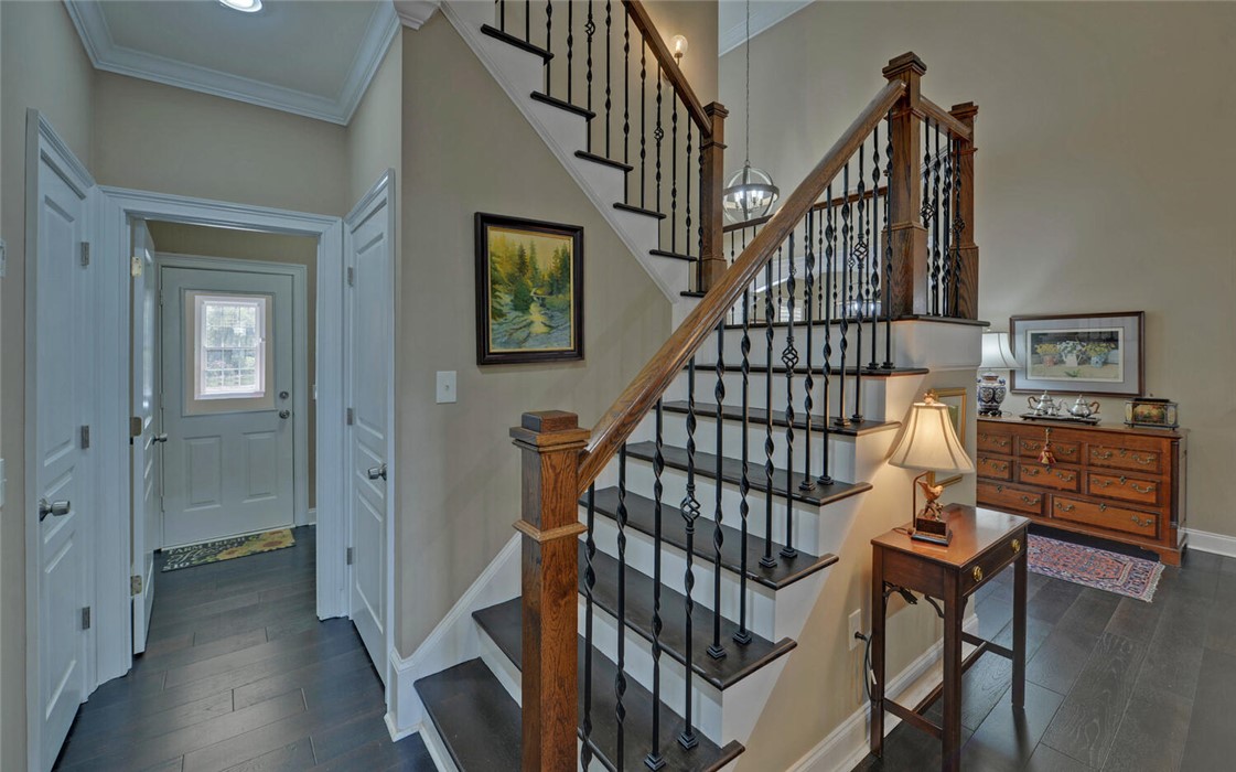 39 Azalea Drive Hartwell, GA 30643 - Photo 25 of 45 This grand staircase with intricate wrought iron balusters makes a striking architectural statement.