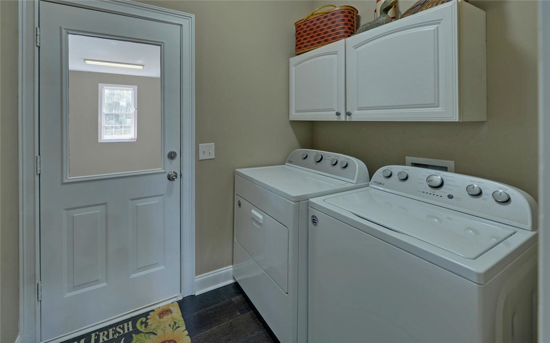 39 Azalea Drive Hartwell, GA 30643 - Photo 27 of 45 This functional laundry room offers convenient appliances and ample storage for daily chores.
