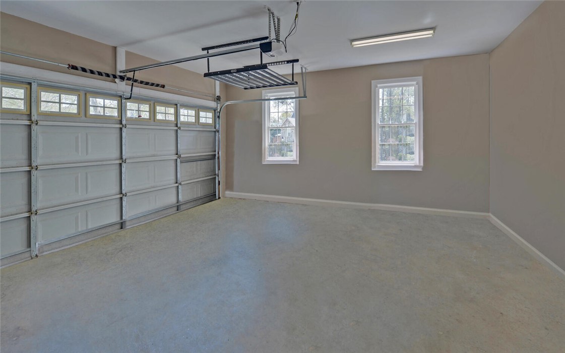 39 Azalea Drive Hartwell, GA 30643 - Photo 28 of 45 This spacious garage offers ample room for vehicles and storage solutions.