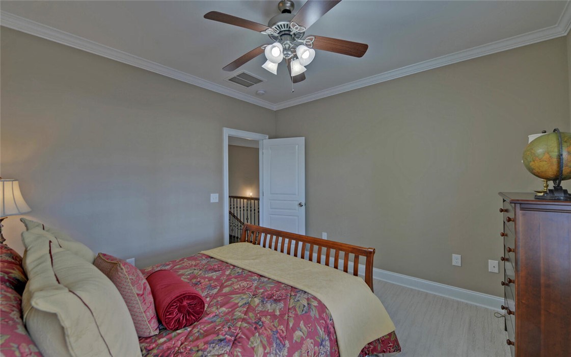 39 Azalea Drive Hartwell, GA 30643 - Photo 30 of 45 This spacious bedroom offers a tranquil retreat with ample natural light.