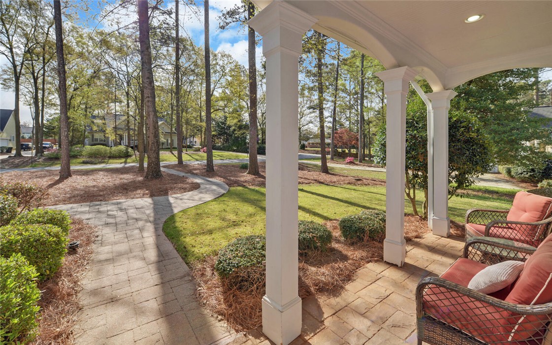 39 Azalea Drive Hartwell, GA 30643 - Photo 4 of 45 Welcome to a charming residence featuring a beautiful brick patio and an inviting pathway.