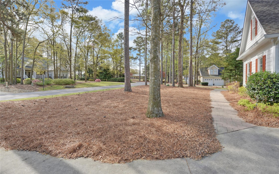 39 Azalea Drive Hartwell, GA 30643 - Photo 44 of 45 Mature trees and a well-maintained yard create a picturesque setting for this home.