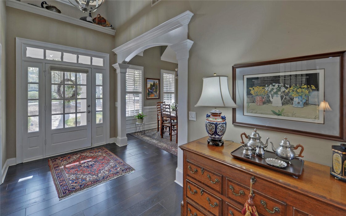39 Azalea Drive Hartwell, GA 30643 - Photo 5 of 45 The inviting entryway features gleaming wood floors and an elegant arched doorway.
