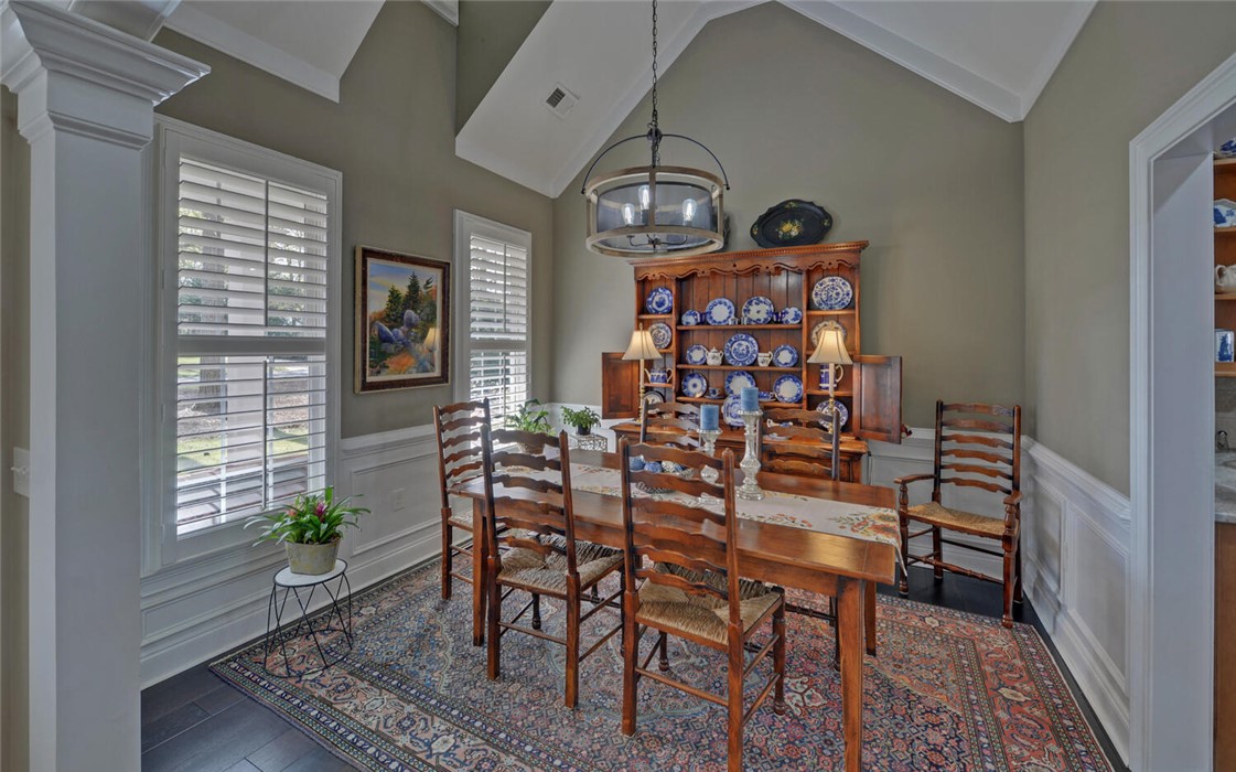 39 Azalea Drive Hartwell, GA 30643 - Photo 7 of 45 This elegant dining room features vaulted ceilings and ample natural light, perfect for intimate gatherings.