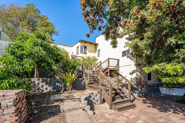 a view of a balcony with plants