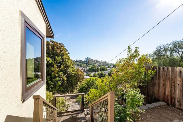a backyard of a house with lots of green space