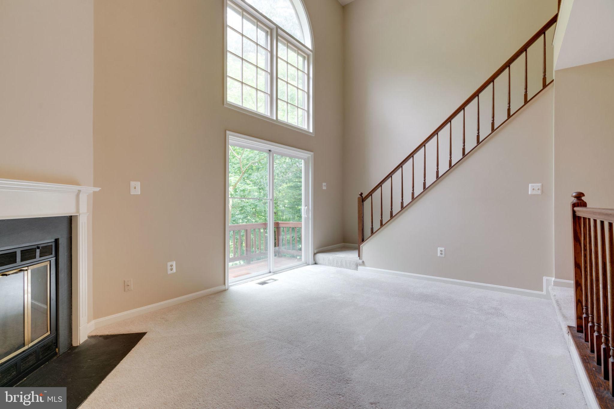 8130 Cliffview Avenue Springfield, VA 22153 - Photo 19 of 50 Living room features fireplace & stunning windows