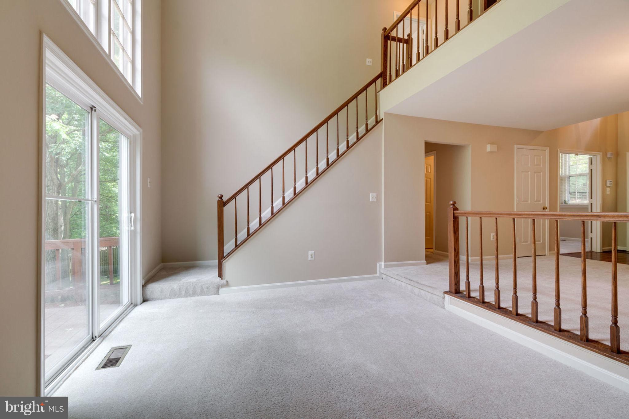 8130 Cliffview Avenue Springfield, VA 22153 - Photo 21 of 50 Living Room, doors to balcony, stairs up