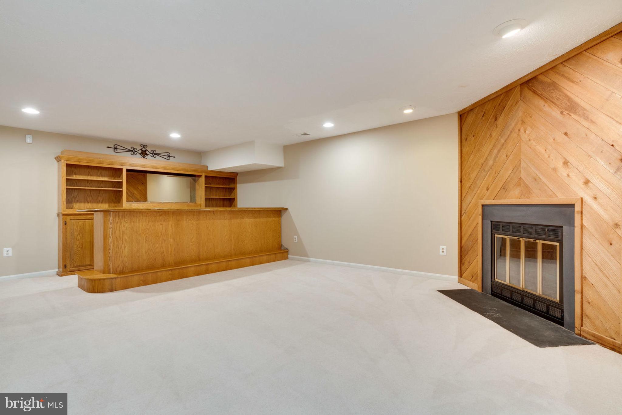 8130 Cliffview Avenue Springfield, VA 22153 - Photo 38 of 50 Basement with gorgeous wood bar, fireplace