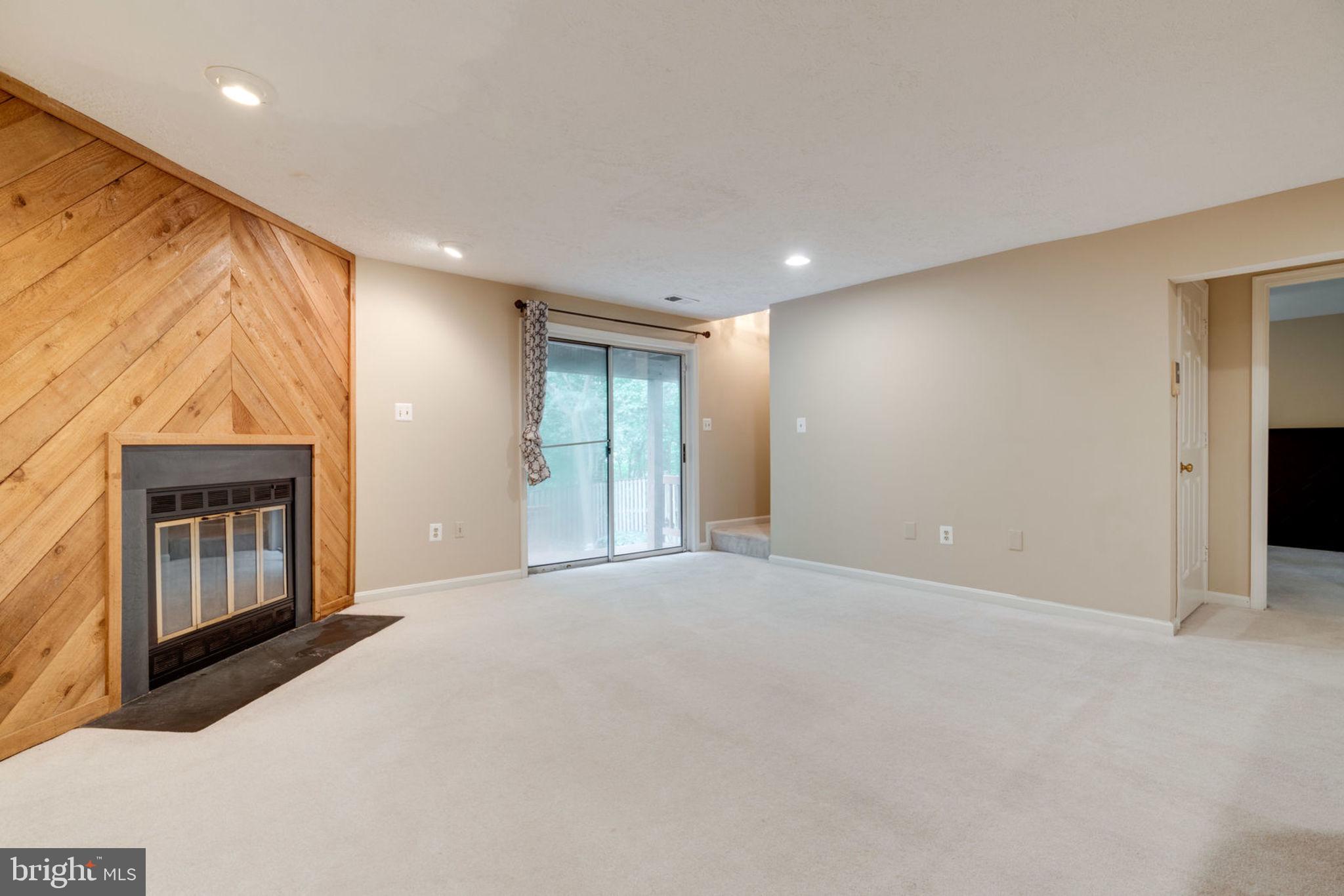 8130 Cliffview Avenue Springfield, VA 22153 - Photo 40 of 50 Basement fireplace and walk out to back deck