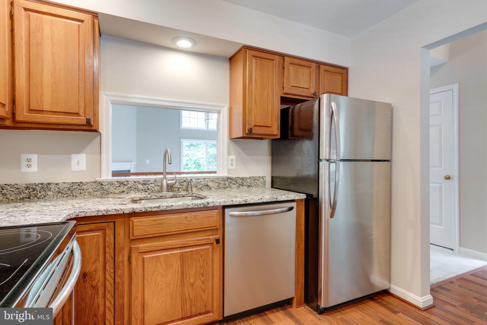 8130 Cliffview Avenue Springfield, VA 22153 - Photo 9 of 50 Kitchen features passthrough to dining area