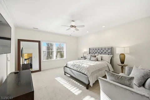 a bedroom with bed and window