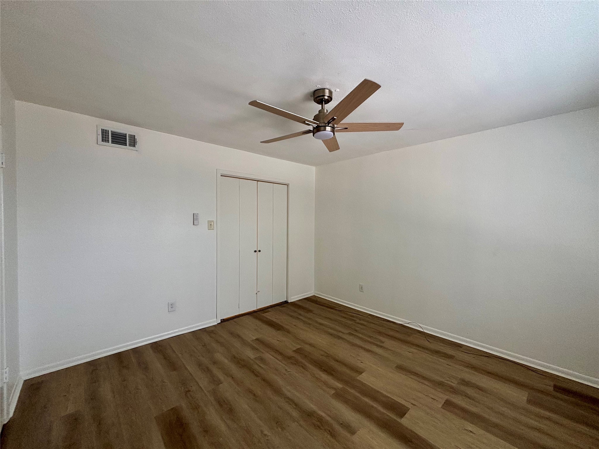 2800 Jeanetta Street, Unit 2008 Houston, TX 77063 - Photo 14 of 22 a view of empty room with wooden floor