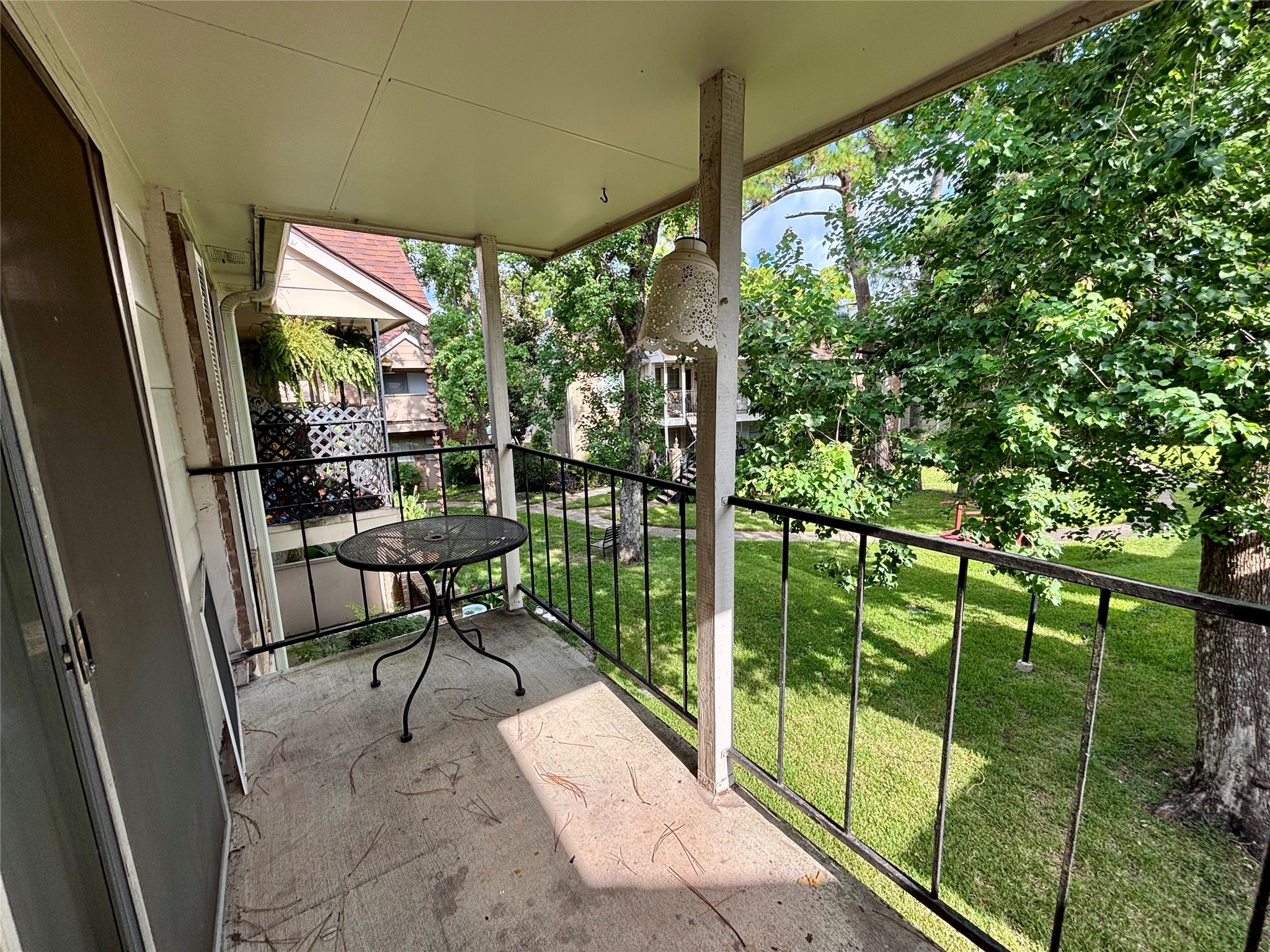 2800 Jeanetta Street, Unit 2008 Houston, TX 77063 - Photo 19 of 22 a view of a porch with chairs and backyard